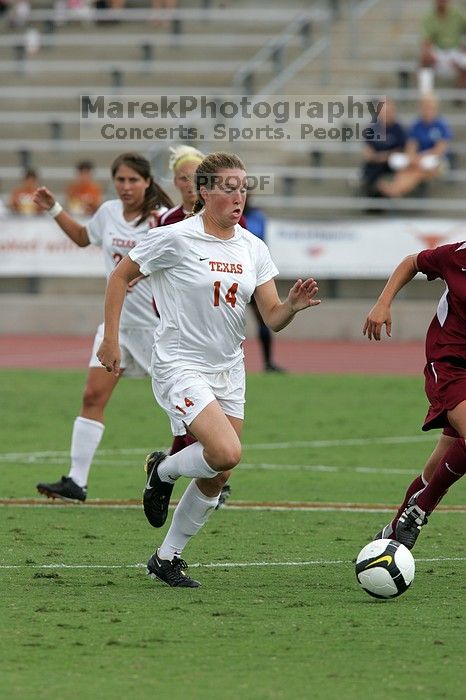 UT senior Kasey Moore (#14, Defender) takes the ball upfield in the second half.  The University of Texas women's soccer team won 2-1 against the Iowa State Cyclones Sunday afternoon, October 5, 2008.

Filename: SRM_20081005_13175267.jpg
Aperture: f/5.6
Shutter Speed: 1/1600
Body: Canon EOS-1D Mark II
Lens: Canon EF 300mm f/2.8 L IS