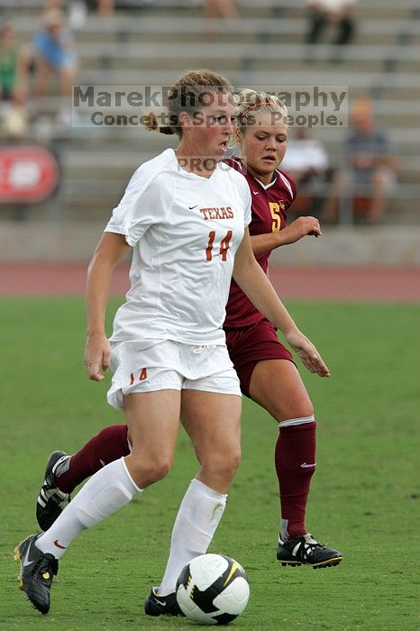 UT senior Kasey Moore (#14, Defender) takes the ball upfield in the second half.  The University of Texas women's soccer team won 2-1 against the Iowa State Cyclones Sunday afternoon, October 5, 2008.

Filename: SRM_20081005_13175677.jpg
Aperture: f/5.6
Shutter Speed: 1/1250
Body: Canon EOS-1D Mark II
Lens: Canon EF 300mm f/2.8 L IS