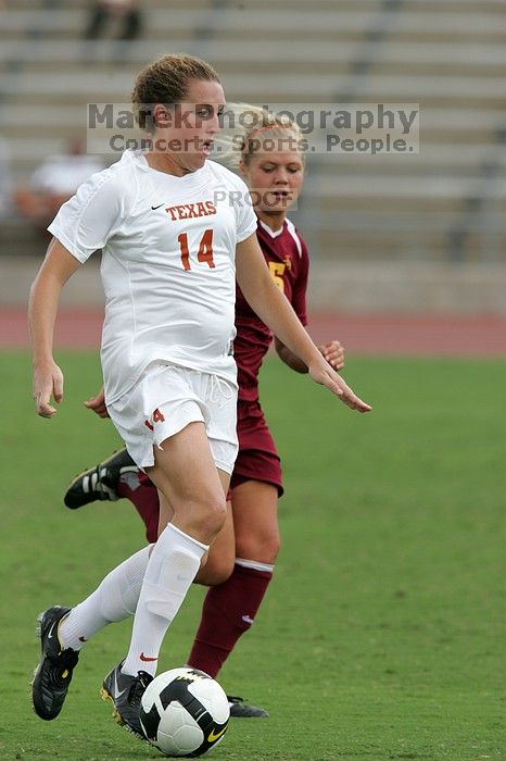 UT senior Kasey Moore (#14, Defender) takes the ball upfield in the second half.  The University of Texas women's soccer team won 2-1 against the Iowa State Cyclones Sunday afternoon, October 5, 2008.

Filename: SRM_20081005_13175678.jpg
Aperture: f/5.6
Shutter Speed: 1/1250
Body: Canon EOS-1D Mark II
Lens: Canon EF 300mm f/2.8 L IS