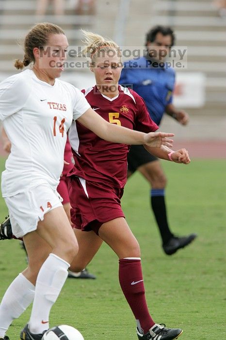 UT senior Kasey Moore (#14, Defender) takes the ball upfield in the second half.  The University of Texas women's soccer team won 2-1 against the Iowa State Cyclones Sunday afternoon, October 5, 2008.

Filename: SRM_20081005_13175884.jpg
Aperture: f/5.6
Shutter Speed: 1/800
Body: Canon EOS-1D Mark II
Lens: Canon EF 300mm f/2.8 L IS