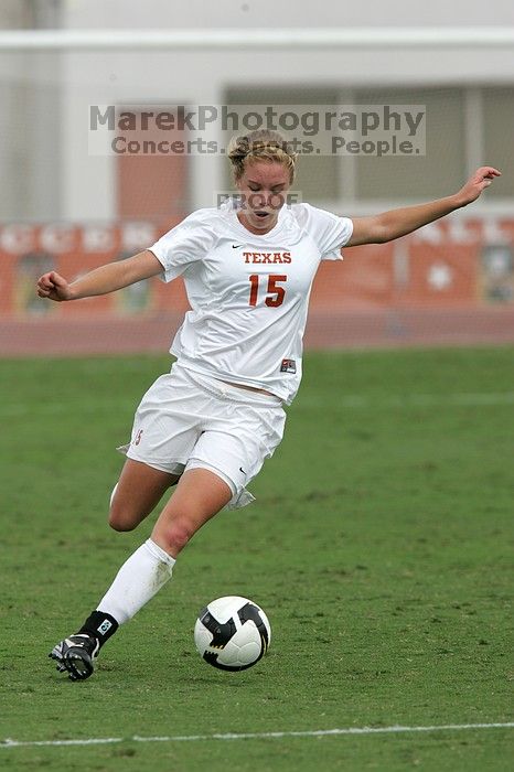 UT freshman Kylie Doniak (#15, Midfielder) crosses the ball in the second half.  The University of Texas women's soccer team won 2-1 against the Iowa State Cyclones Sunday afternoon, October 5, 2008.

Filename: SRM_20081005_13181400.jpg
Aperture: f/5.6
Shutter Speed: 1/1600
Body: Canon EOS-1D Mark II
Lens: Canon EF 300mm f/2.8 L IS