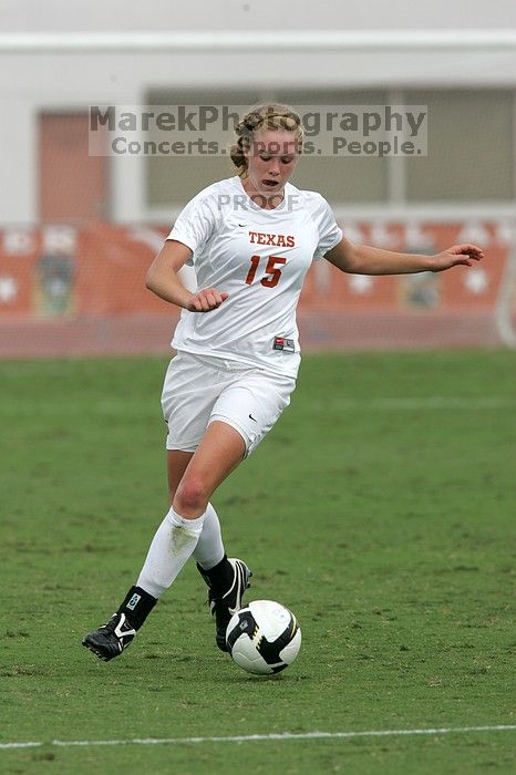 UT freshman Kylie Doniak (#15, Midfielder) crosses the ball in the second half.  The University of Texas women's soccer team won 2-1 against the Iowa State Cyclones Sunday afternoon, October 5, 2008.

Filename: SRM_20081005_13181499.jpg
Aperture: f/5.6
Shutter Speed: 1/1600
Body: Canon EOS-1D Mark II
Lens: Canon EF 300mm f/2.8 L IS