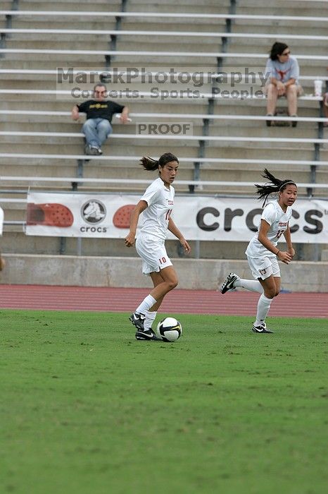 UT freshman Amanda Lisberger (#13, Midfielder) passes the ball to UT senior Stephanie Logterman (#10, Defender) in the second half.  The University of Texas women's soccer team won 2-1 against the Iowa State Cyclones Sunday afternoon, October 5, 2008.

Filename: SRM_20081005_13253284.jpg
Aperture: f/5.6
Shutter Speed: 1/1600
Body: Canon EOS-1D Mark II
Lens: Canon EF 300mm f/2.8 L IS