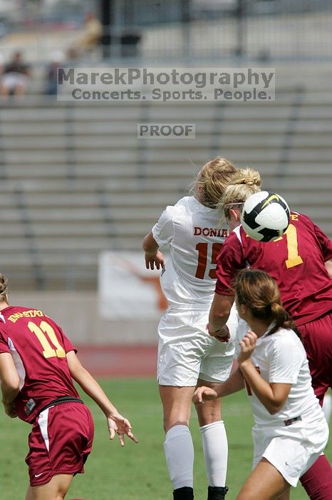 UT freshman Kylie Doniak (#15, Midfielder) with the header in the second half.  The University of Texas women's soccer team won 2-1 against the Iowa State Cyclones Sunday afternoon, October 5, 2008.

Filename: SRM_20081005_13412049.jpg
Aperture: f/5.6
Shutter Speed: 1/2500
Body: Canon EOS-1D Mark II
Lens: Canon EF 300mm f/2.8 L IS