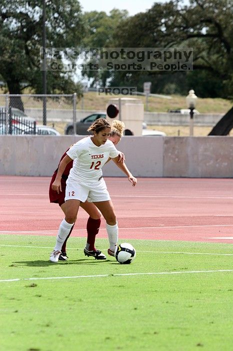 UT sophomore Alisha Ortiz (#12, Forward) in the second half.  The University of Texas women's soccer team won 2-1 against the Iowa State Cyclones Sunday afternoon, October 5, 2008.

Filename: SRM_20081005_13430425.jpg
Aperture: f/5.0
Shutter Speed: 1/2000
Body: Canon EOS 20D
Lens: Canon EF 80-200mm f/2.8 L