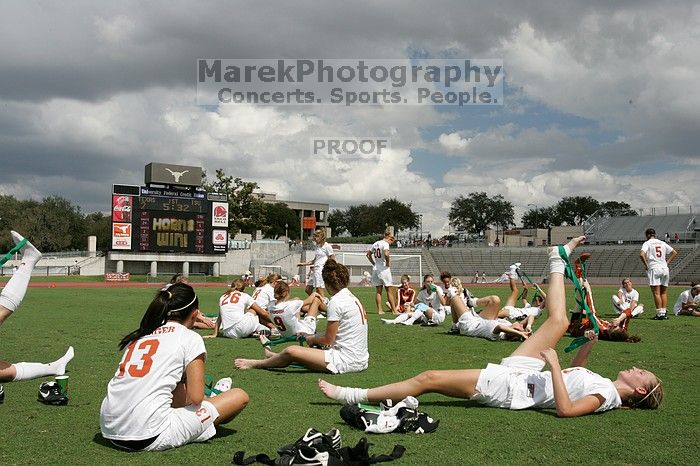 The team stretches after the match.  The University of Texas women's soccer team won 2-1 against the Iowa State Cyclones Sunday afternoon, October 5, 2008.

Filename: SRM_20081005_13532051.jpg
Aperture: f/11.0
Shutter Speed: 1/320
Body: Canon EOS-1D Mark II
Lens: Canon EF 16-35mm f/2.8 L