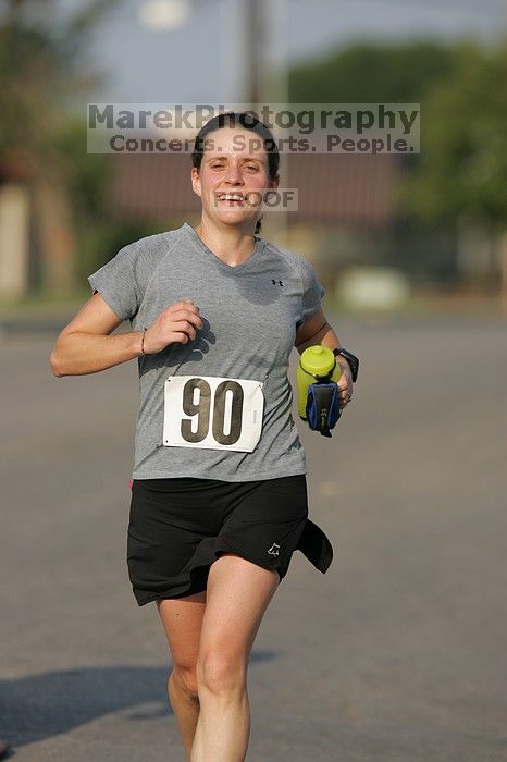 Beth Marek won first place in her age division at the Army Dillo half-marathon and 32K race.

Filename: SRM_20080921_0841400.jpg
Aperture: f/4.0
Shutter Speed: 1/2000
Body: Canon EOS-1D Mark II
Lens: Canon EF 300mm f/2.8 L IS