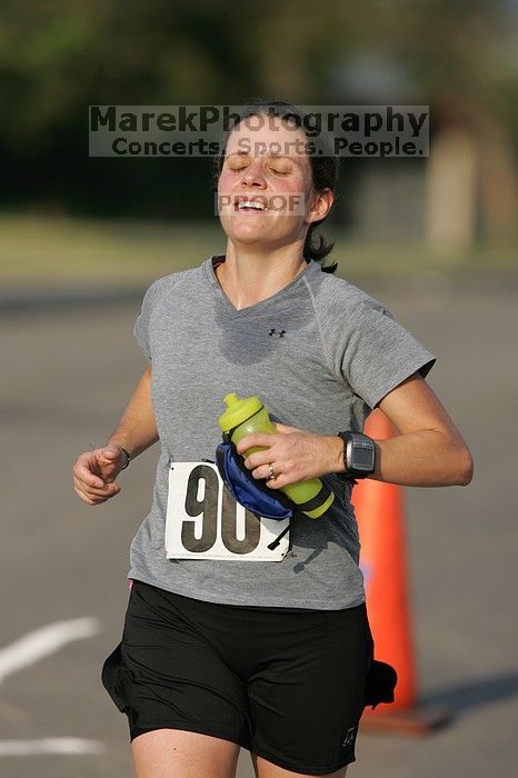 Beth Marek won first place in her age division at the Army Dillo half-marathon and 32K race.

Filename: SRM_20080921_0841428.jpg
Aperture: f/4.0
Shutter Speed: 1/2000
Body: Canon EOS-1D Mark II
Lens: Canon EF 300mm f/2.8 L IS