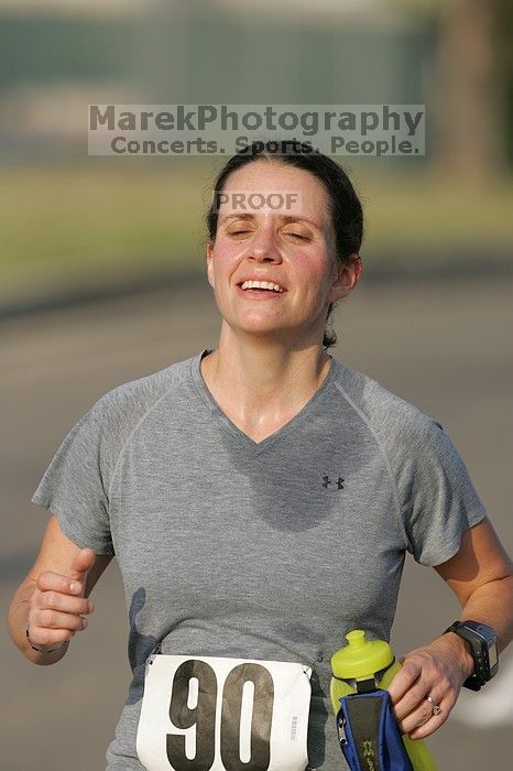 Beth Marek won first place in her age division at the Army Dillo half-marathon and 32K race.

Filename: SRM_20080921_0841445.jpg
Aperture: f/4.0
Shutter Speed: 1/2000
Body: Canon EOS-1D Mark II
Lens: Canon EF 300mm f/2.8 L IS