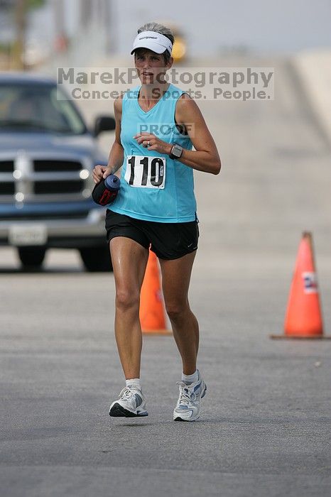 Karen Pearce placed second in her age groun at the Army Dillo half-marathon and 32K race.

Filename: SRM_20080921_1056423.jpg
Aperture: f/4.0
Shutter Speed: 1/2500
Body: Canon EOS-1D Mark II
Lens: Canon EF 300mm f/2.8 L IS