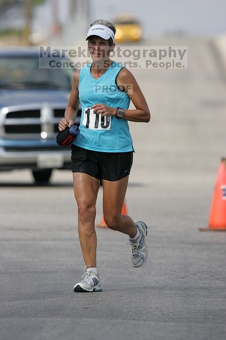 Karen Pearce placed second in her age groun at the Army Dillo half-marathon and 32K race.

Filename: SRM_20080921_1056424.jpg
Aperture: f/4.0
Shutter Speed: 1/2500
Body: Canon EOS-1D Mark II
Lens: Canon EF 300mm f/2.8 L IS