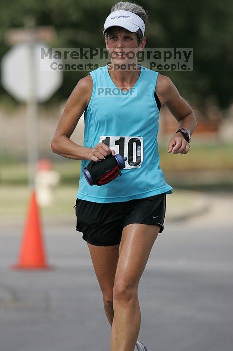 Karen Pearce placed second in her age groun at the Army Dillo half-marathon and 32K race.

Filename: SRM_20080921_1056445.jpg
Aperture: f/4.0
Shutter Speed: 1/2000
Body: Canon EOS-1D Mark II
Lens: Canon EF 300mm f/2.8 L IS