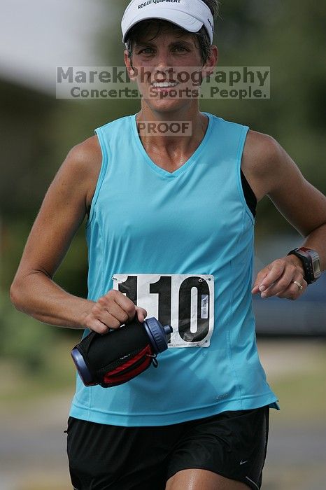 Karen Pearce placed second in her age groun at the Army Dillo half-marathon and 32K race.

Filename: SRM_20080921_1056483.jpg
Aperture: f/4.0
Shutter Speed: 1/2500
Body: Canon EOS-1D Mark II
Lens: Canon EF 300mm f/2.8 L IS