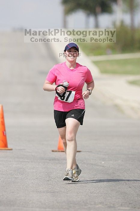 Meredith Cohen running the Army Dillo half-marathon and 32K race.

Filename: SRM_20080921_1115565.jpg
Aperture: f/4.0
Shutter Speed: 1/2000
Body: Canon EOS-1D Mark II
Lens: Canon EF 300mm f/2.8 L IS