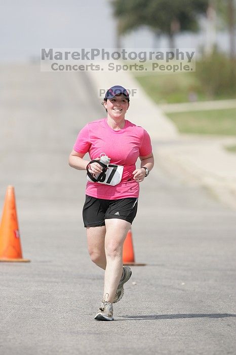 Meredith Cohen running the Army Dillo half-marathon and 32K race.

Filename: SRM_20080921_1115566.jpg
Aperture: f/4.0
Shutter Speed: 1/2000
Body: Canon EOS-1D Mark II
Lens: Canon EF 300mm f/2.8 L IS