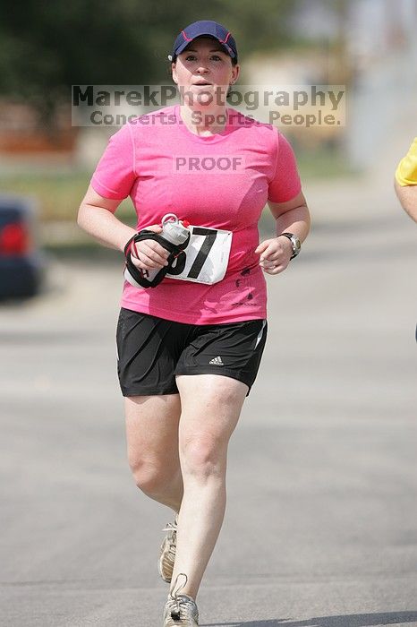 Meredith Cohen running the Army Dillo half-marathon and 32K race.

Filename: SRM_20080921_1115588.jpg
Aperture: f/4.0
Shutter Speed: 1/2000
Body: Canon EOS-1D Mark II
Lens: Canon EF 300mm f/2.8 L IS