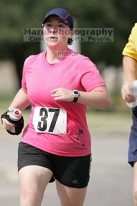 Meredith Cohen running the Army Dillo half-marathon and 32K race.

Filename: SRM_20080921_1116001.jpg
Aperture: f/4.0
Shutter Speed: 1/2000
Body: Canon EOS-1D Mark II
Lens: Canon EF 300mm f/2.8 L IS