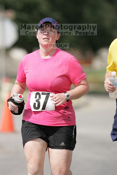 Meredith Cohen running the Army Dillo half-marathon and 32K race.

Filename: SRM_20080921_1116009.jpg
Aperture: f/4.0
Shutter Speed: 1/2000
Body: Canon EOS-1D Mark II
Lens: Canon EF 300mm f/2.8 L IS