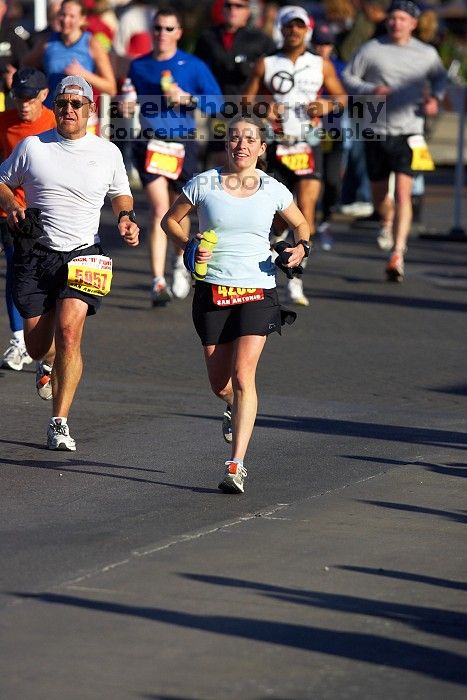 Beth Marek, bib #4236, completed the course in 3:38:21, a Boston Marathon qualifying time.  The first annual San Antonio Rock and Roll Marathon, Sunday, November 16, 2008.

Filename: SRM_20081116_08515206.jpg
Aperture: f/4.0
Shutter Speed: 1/2500
Body: Canon EOS-1D Mark II
Lens: Canon EF 300mm f/2.8 L IS