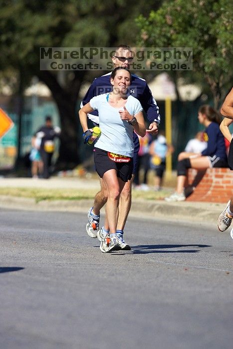 Beth Marek, bib #4236, completed the course in 3:38:21, a Boston Marathon qualifying time.  The first annual San Antonio Rock and Roll Marathon, Sunday, November 16, 2008.

Filename: SRM_20081116_11152043.jpg
Aperture: f/4.0
Shutter Speed: 1/2500
Body: Canon EOS-1D Mark II
Lens: Canon EF 300mm f/2.8 L IS