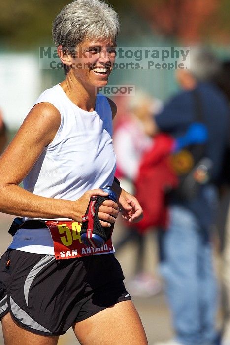 Karen Pearce.  The first annual San Antonio Rock and Roll Marathon, Sunday, November 16, 2008.

Filename: SRM_20081116_12014069.jpg
Aperture: f/4.0
Shutter Speed: 1/3200
Body: Canon EOS-1D Mark II
Lens: Canon EF 300mm f/2.8 L IS