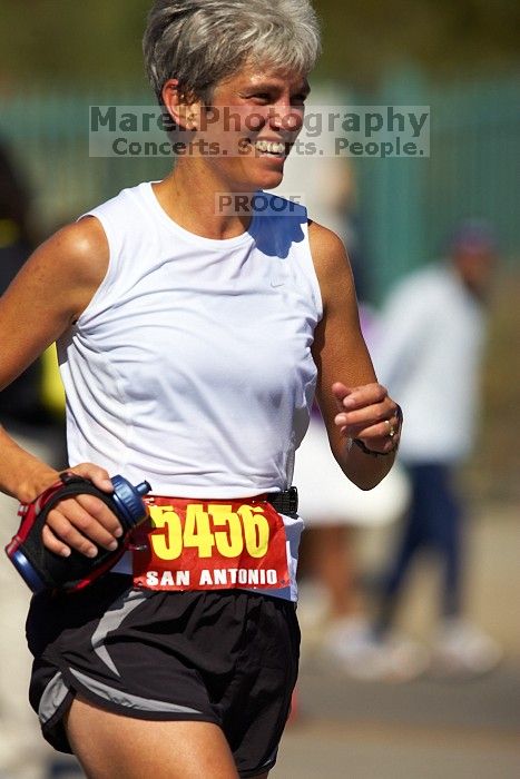 Karen Pearce.  The first annual San Antonio Rock and Roll Marathon, Sunday, November 16, 2008.

Filename: SRM_20081116_12014270.jpg
Aperture: f/4.0
Shutter Speed: 1/4000
Body: Canon EOS-1D Mark II
Lens: Canon EF 300mm f/2.8 L IS