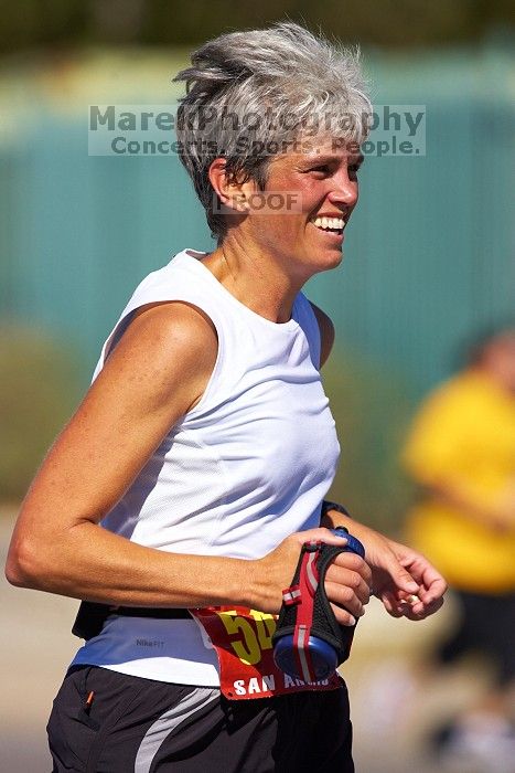 Karen Pearce.  The first annual San Antonio Rock and Roll Marathon, Sunday, November 16, 2008.

Filename: SRM_20081116_12014272.jpg
Aperture: f/4.0
Shutter Speed: 1/3200
Body: Canon EOS-1D Mark II
Lens: Canon EF 300mm f/2.8 L IS