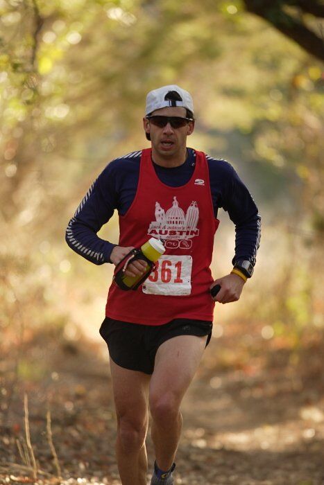 Paul Terranova placed first in his age group, fourth overall in the 25K at the Bandera 25K, 50K, and 100K trail race in Bandera, TX on Saturday, January 10, 2009.

Filename: SRM_20090110_09023850.jpg
Aperture: f/2.8
Shutter Speed: 1/400
Body: Canon EOS-1D Mark II
Lens: Canon EF 300mm f/2.8 L IS