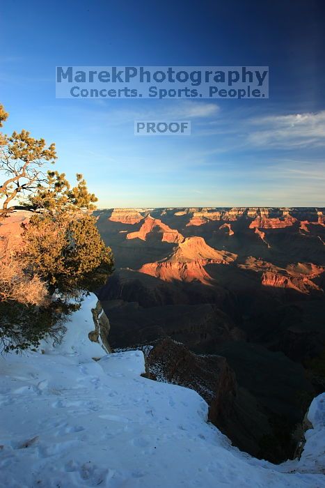 First sunrise of the new year at the south rim of the Grand Canyon, Thursday January 1, 2009.  The temperature was as low as 15 F the night before with a foot and a half of snow on the ground.  Luckily sunrise wasn't until 7:40.

Filename: SRM_20090101_08050836.JPG
Aperture: f/14.0
Shutter Speed: 1/6
Body: Canon EOS-1D Mark II
Lens: Canon EF 16-35mm f/2.8 L