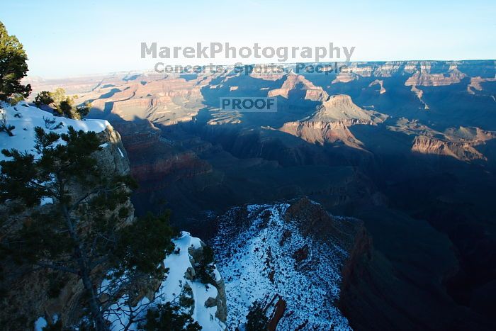 First sunrise of the new year at the south rim of the Grand Canyon, Thursday January 1, 2009.  The temperature was as low as 15 F the night before with a foot and a half of snow on the ground.  Luckily sunrise wasn't until 7:40.

Filename: SRM_20090101_08074038.JPG
Aperture: f/16.0
Shutter Speed: 1/8
Body: Canon EOS-1D Mark II
Lens: Canon EF 16-35mm f/2.8 L