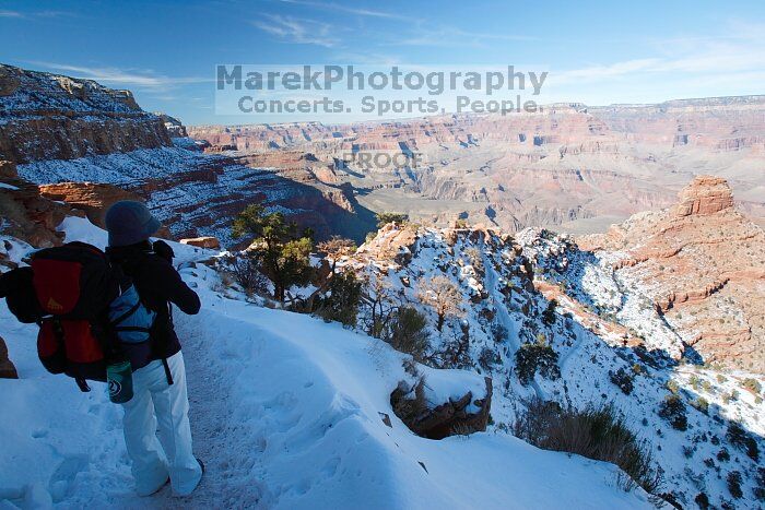 Beth Marek hiking down the South Kaibab trail, backpacking the Grand Canyon with Beth, Thursday, January 1, 2009.

Filename: SRM_20090101_12392294.jpg
Aperture: f/11.0
Shutter Speed: 1/80
Body: Canon EOS-1D Mark II
Lens: Canon EF 16-35mm f/2.8 L