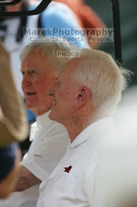 One of these guys is Darrell Royal (I think?).  The University of Texas football team defeated the Arkansas Razorbacks with a score of 52-10 in Austin, TX on Saturday, September 27, 2008.

Filename: SRM_20080927_14160201.jpg
Aperture: f/4.0
Shutter Speed: 1/1250
Body: Canon EOS-1D Mark II
Lens: Canon EF 300mm f/2.8 L IS