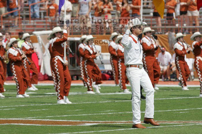 The UT marching band takes the field before the Arkansas football game.  The University of Texas football team defeated the Arkansas Razorbacks with a score of 52-10 in Austin, TX on Saturday, September 27, 2008.

Filename: SRM_20080927_14194016.jpg
Aperture: f/5.6
Shutter Speed: 1/1600
Body: Canon EOS-1D Mark II
Lens: Canon EF 300mm f/2.8 L IS