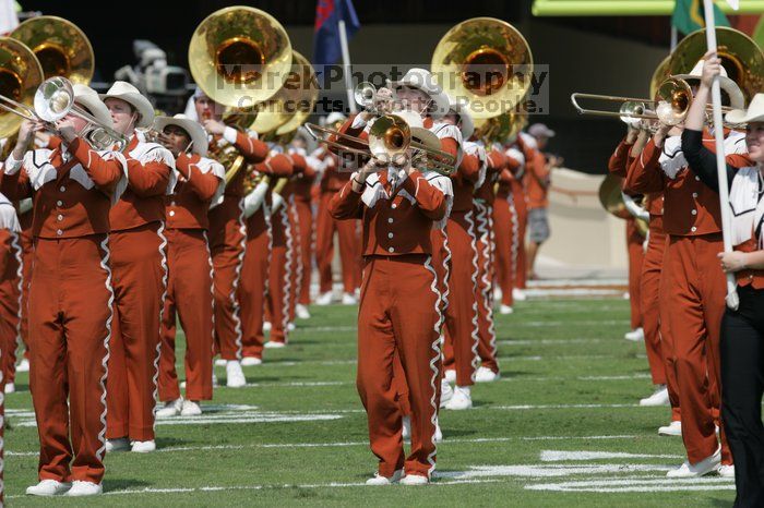 The UT marching band takes the field before the Arkansas football game.  The University of Texas football team defeated the Arkansas Razorbacks with a score of 52-10 in Austin, TX on Saturday, September 27, 2008.

Filename: SRM_20080927_14195418.jpg
Aperture: f/5.6
Shutter Speed: 1/1600
Body: Canon EOS-1D Mark II
Lens: Canon EF 300mm f/2.8 L IS