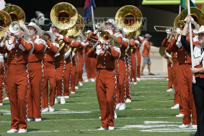 The UT marching band takes the field before the Arkansas football game.  The University of Texas football team defeated the Arkansas Razorbacks with a score of 52-10 in Austin, TX on Saturday, September 27, 2008.

Filename: SRM_20080927_14195419.jpg
Aperture: f/5.6
Shutter Speed: 1/1600
Body: Canon EOS-1D Mark II
Lens: Canon EF 300mm f/2.8 L IS