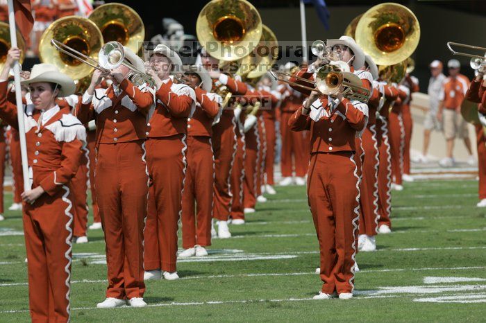 The UT marching band takes the field before the Arkansas football game.  The University of Texas football team defeated the Arkansas Razorbacks with a score of 52-10 in Austin, TX on Saturday, September 27, 2008.

Filename: SRM_20080927_14200021.jpg
Aperture: f/5.6
Shutter Speed: 1/1600
Body: Canon EOS-1D Mark II
Lens: Canon EF 300mm f/2.8 L IS