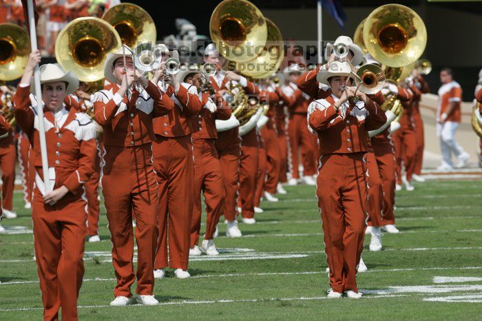 The UT marching band takes the field before the Arkansas football game.  The University of Texas football team defeated the Arkansas Razorbacks with a score of 52-10 in Austin, TX on Saturday, September 27, 2008.

Filename: SRM_20080927_14200422.jpg
Aperture: f/5.6
Shutter Speed: 1/1600
Body: Canon EOS-1D Mark II
Lens: Canon EF 300mm f/2.8 L IS