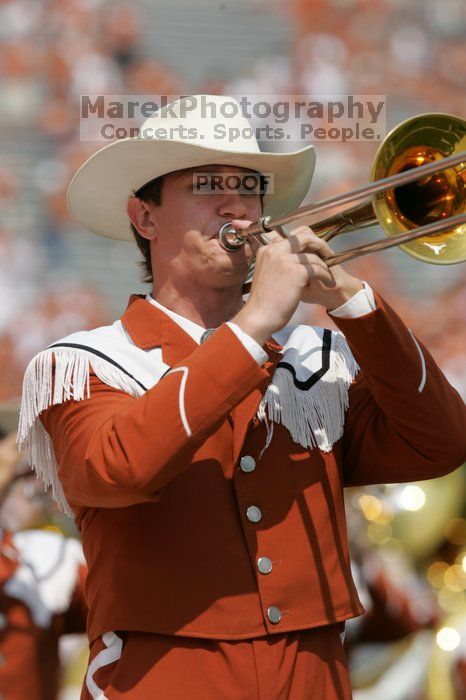 The UT marching band takes the field before the Arkansas football game.  The University of Texas football team defeated the Arkansas Razorbacks with a score of 52-10 in Austin, TX on Saturday, September 27, 2008.

Filename: SRM_20080927_14202428.jpg
Aperture: f/5.6
Shutter Speed: 1/1600
Body: Canon EOS-1D Mark II
Lens: Canon EF 300mm f/2.8 L IS