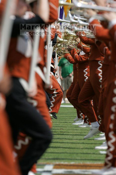 The UT marching band takes the field before the Arkansas football game.  The University of Texas football team defeated the Arkansas Razorbacks with a score of 52-10 in Austin, TX on Saturday, September 27, 2008.

Filename: SRM_20080927_14205643.jpg
Aperture: f/5.6
Shutter Speed: 1/1250
Body: Canon EOS-1D Mark II
Lens: Canon EF 300mm f/2.8 L IS