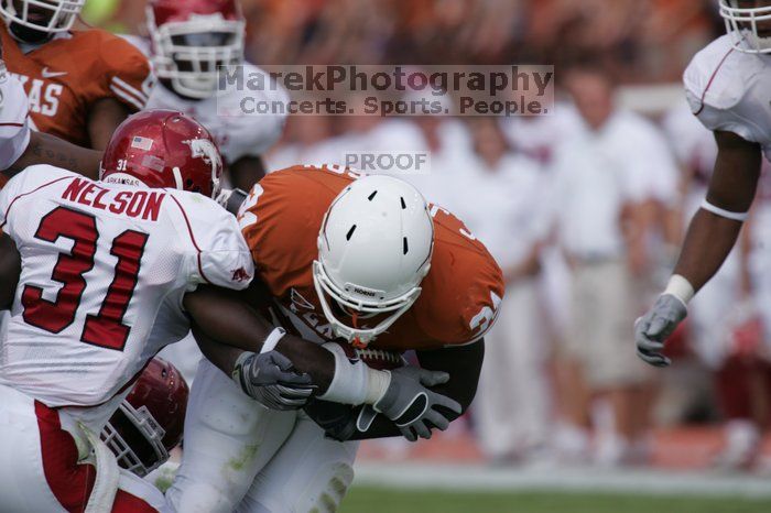 The University of Texas football team defeated the Arkansas Razorbacks with a score of 52-10 in Austin, TX on Saturday, September 27, 2008.

Filename: SRM_20080927_14575253.jpg
Aperture: f/5.6
Shutter Speed: 1/1250
Body: Canon EOS-1D Mark II
Lens: Canon EF 300mm f/2.8 L IS