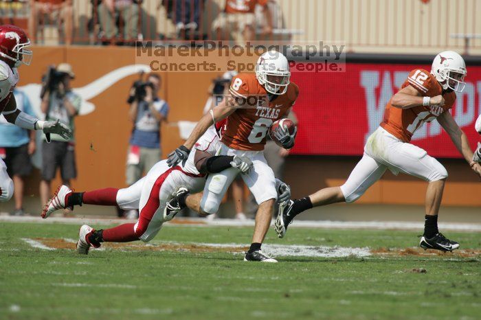 The University of Texas football team defeated the Arkansas Razorbacks with a score of 52-10 in Austin, TX on Saturday, September 27, 2008.

Filename: SRM_20080927_15090888.jpg
Aperture: f/5.6
Shutter Speed: 1/2000
Body: Canon EOS-1D Mark II
Lens: Canon EF 300mm f/2.8 L IS