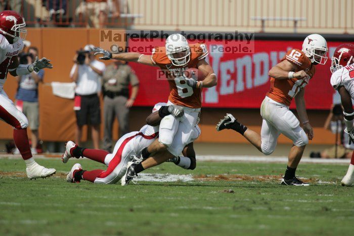 The University of Texas football team defeated the Arkansas Razorbacks with a score of 52-10 in Austin, TX on Saturday, September 27, 2008.

Filename: SRM_20080927_15090889.jpg
Aperture: f/5.6
Shutter Speed: 1/2500
Body: Canon EOS-1D Mark II
Lens: Canon EF 300mm f/2.8 L IS