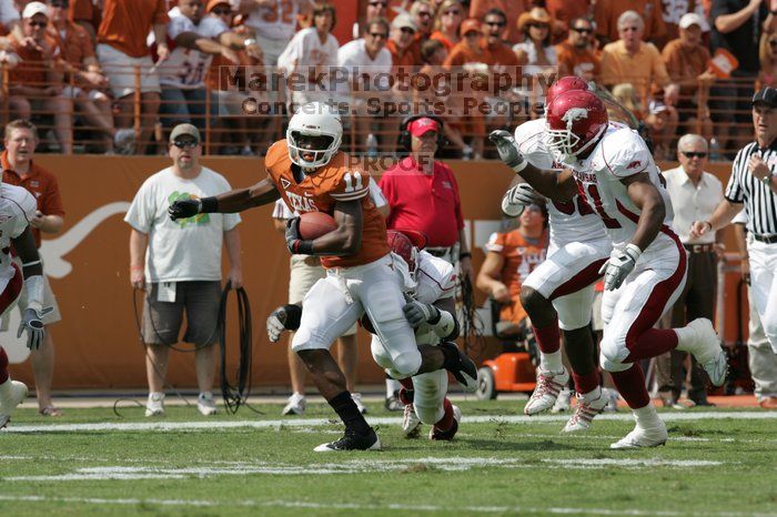 The University of Texas football team defeated the Arkansas Razorbacks with a score of 52-10 in Austin, TX on Saturday, September 27, 2008.

Filename: SRM_20080927_15121820.jpg
Aperture: f/5.6
Shutter Speed: 1/1600
Body: Canon EOS-1D Mark II
Lens: Canon EF 300mm f/2.8 L IS