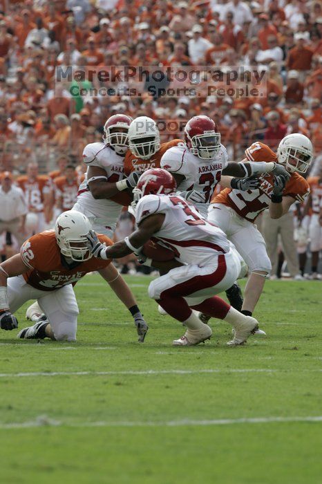 The University of Texas football team defeated the Arkansas Razorbacks with a score of 52-10 in Austin, TX on Saturday, September 27, 2008.

Filename: SRM_20080927_15191267.jpg
Aperture: f/6.3
Shutter Speed: 1/640
Body: Canon EOS-1D Mark II
Lens: Canon EF 300mm f/2.8 L IS