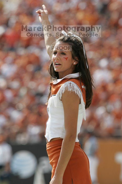 Texas Cheerleaders.  The University of Texas football team defeated the Arkansas Razorbacks with a score of 52-10 in Austin, TX on Saturday, September 27, 2008.

Filename: SRM_20080927_15401278.jpg
Aperture: f/5.6
Shutter Speed: 1/1250
Body: Canon EOS-1D Mark II
Lens: Canon EF 300mm f/2.8 L IS