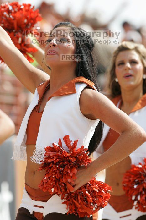 Texas Pom.  The University of Texas football team defeated the Arkansas Razorbacks with a score of 52-10 in Austin, TX on Saturday, September 27, 2008.

Filename: SRM_20080927_15415286.jpg
Aperture: f/5.6
Shutter Speed: 1/1000
Body: Canon EOS-1D Mark II
Lens: Canon EF 300mm f/2.8 L IS