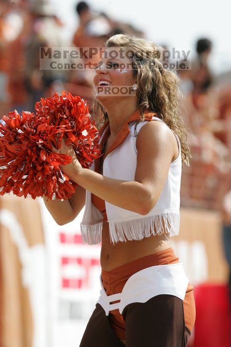 Texas Pom.  The University of Texas football team defeated the Arkansas Razorbacks with a score of 52-10 in Austin, TX on Saturday, September 27, 2008.

Filename: SRM_20080927_15415488.jpg
Aperture: f/5.6
Shutter Speed: 1/1250
Body: Canon EOS-1D Mark II
Lens: Canon EF 300mm f/2.8 L IS