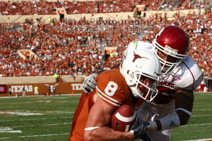 The University of Texas football team defeated the Arkansas Razorbacks with a score of 52-10 in Austin, TX on Saturday, September 27, 2008.

Filename: SRM_20080927_16470298.jpg
Aperture: f/5.6
Shutter Speed: 1/3200
Body: Canon EOS 20D
Lens: Canon EF 80-200mm f/2.8 L