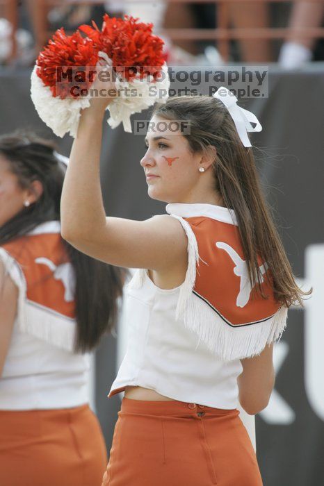 Texas Cheerleaders.  The University of Texas football team defeated the Arkansas Razorbacks with a score of 52-10 in Austin, TX on Saturday, September 27, 2008.

Filename: SRM_20080927_17102071.jpg
Aperture: f/5.6
Shutter Speed: 1/500
Body: Canon EOS-1D Mark II
Lens: Canon EF 300mm f/2.8 L IS