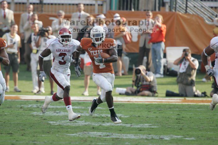 The University of Texas football team defeated the Arkansas Razorbacks with a score of 52-10 in Austin, TX on Saturday, September 27, 2008.

Filename: SRM_20080927_17161877.jpg
Aperture: f/5.6
Shutter Speed: 1/800
Body: Canon EOS-1D Mark II
Lens: Canon EF 300mm f/2.8 L IS